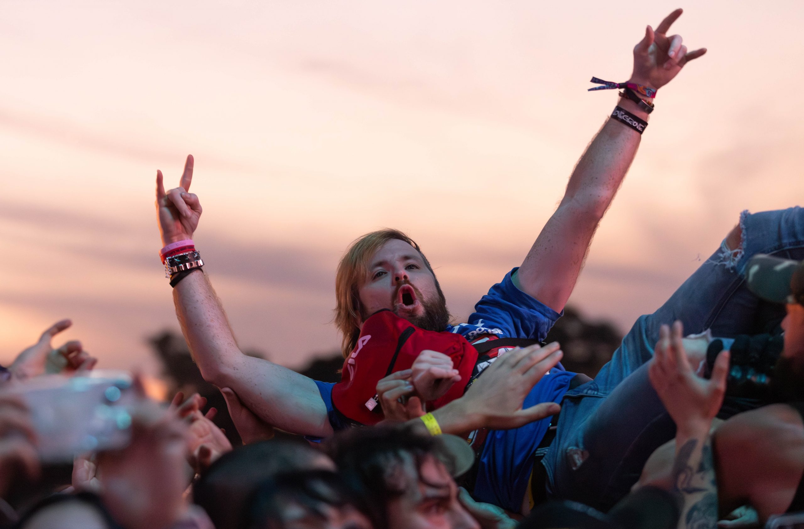 A fan crowdsurfing at Riot Fest 2023